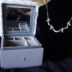 Two necklaces and one jewelry box